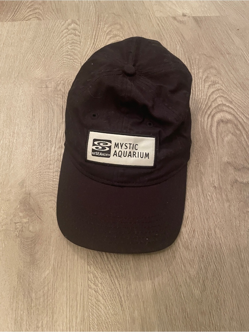 Black baseball hat mystic aquarium CT